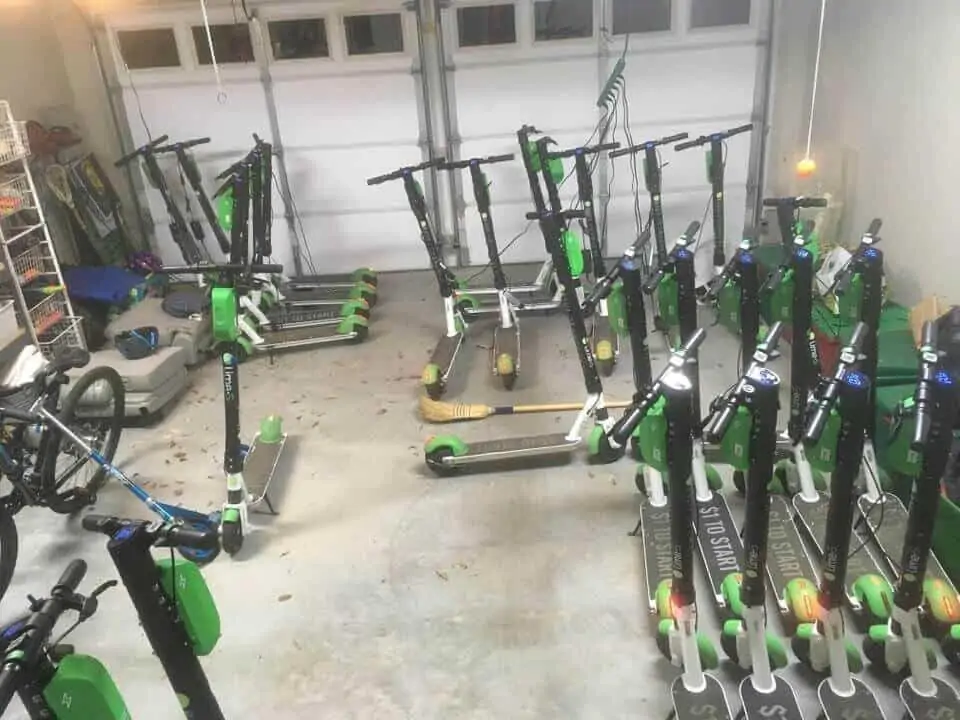 Dozens of scooters in a garage