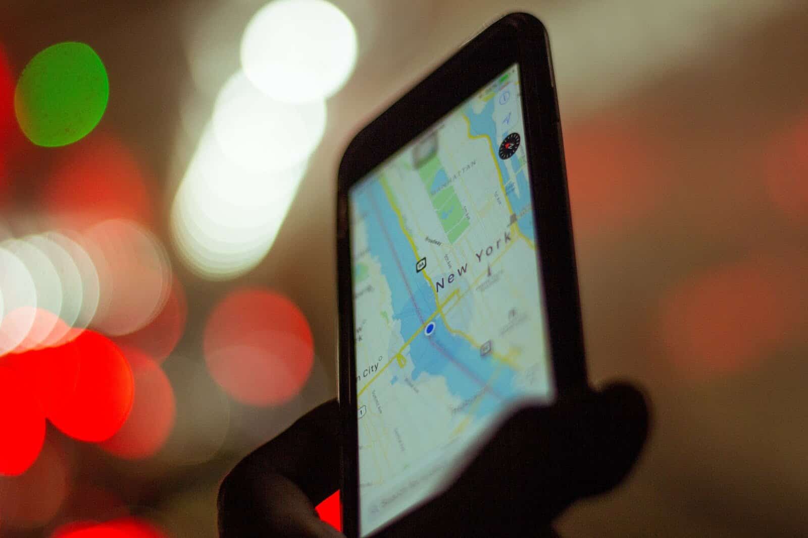 Person holding map of New York on iPhone