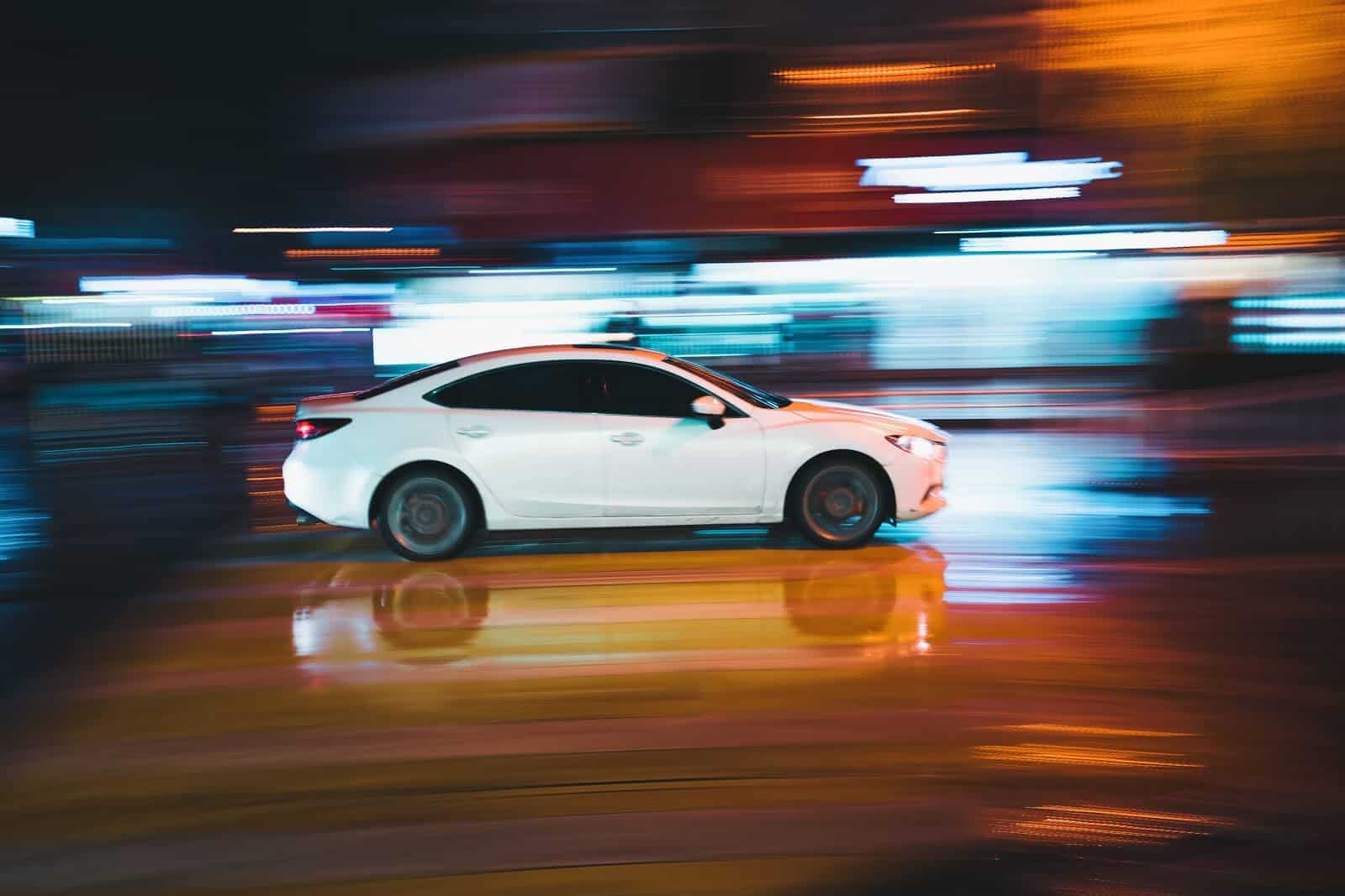 White car with motion blur background