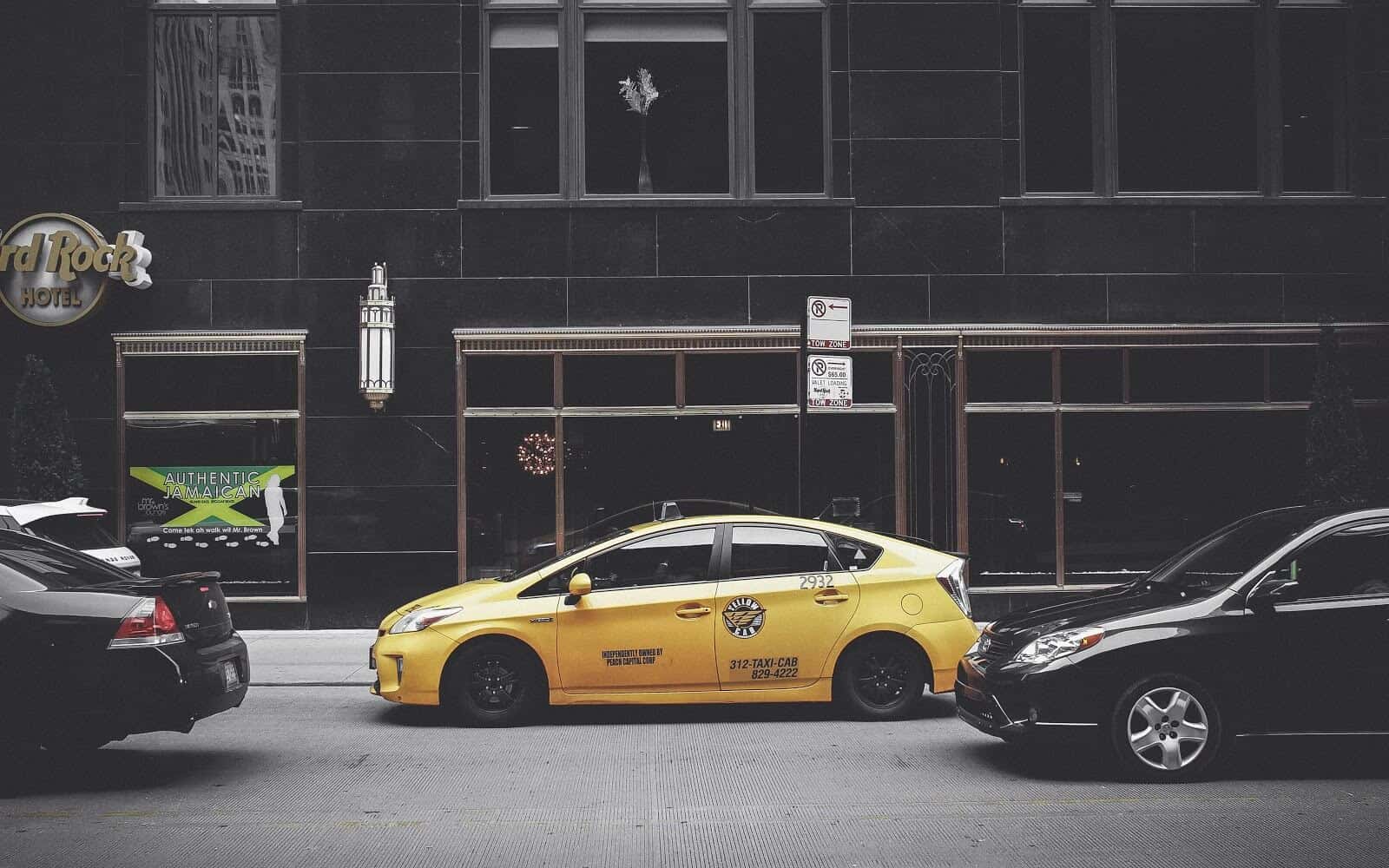 Taxi parked in front of downtown building