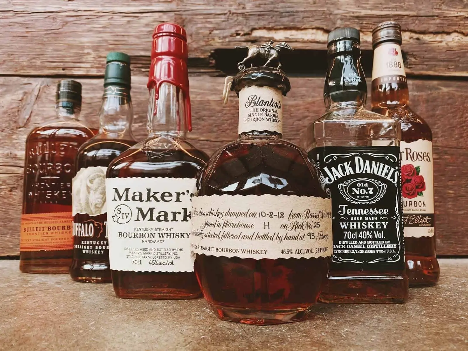 Different bottles of whiskey lined up