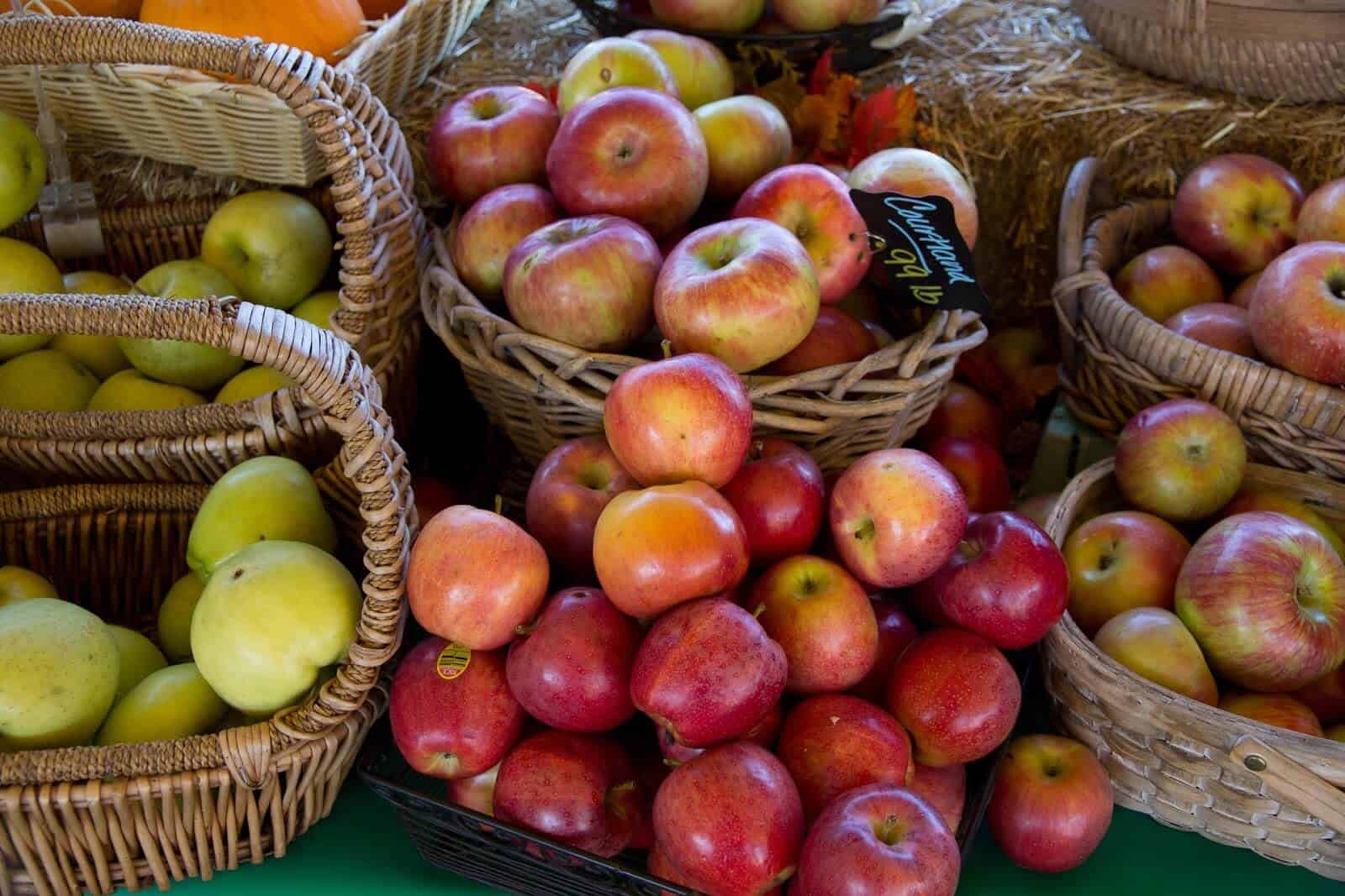 Red apples and green apples in baskets