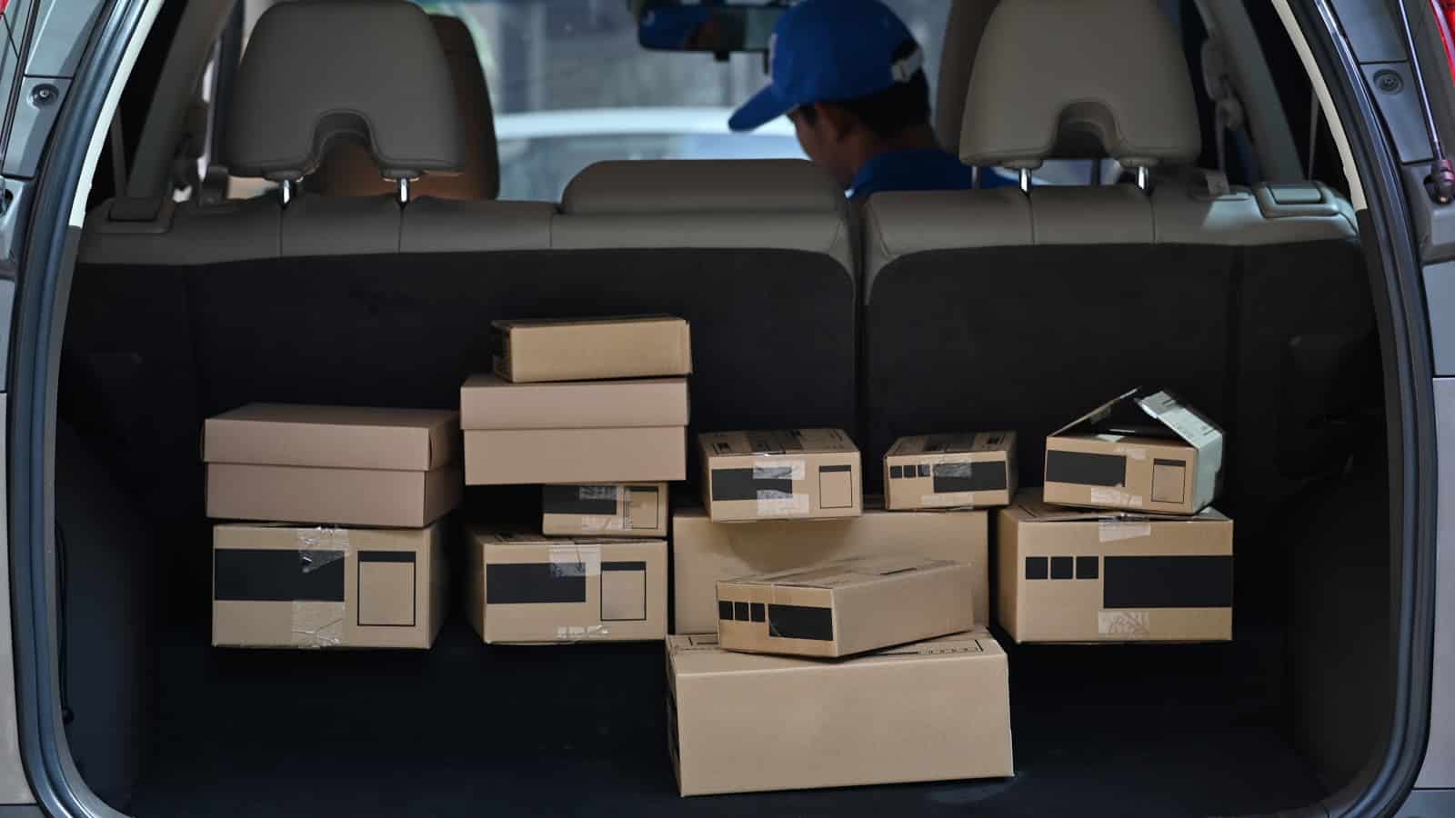 Apply for Amazon Flex: the back of an SUV, filled with packages