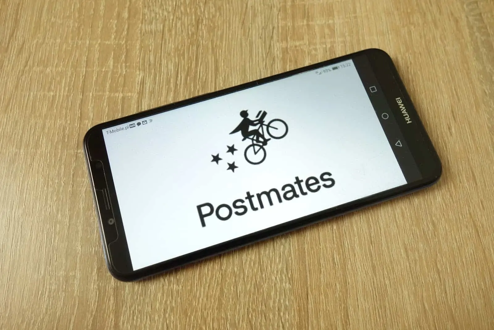 Drive for Postmates: The Postmates logo on a smartphone