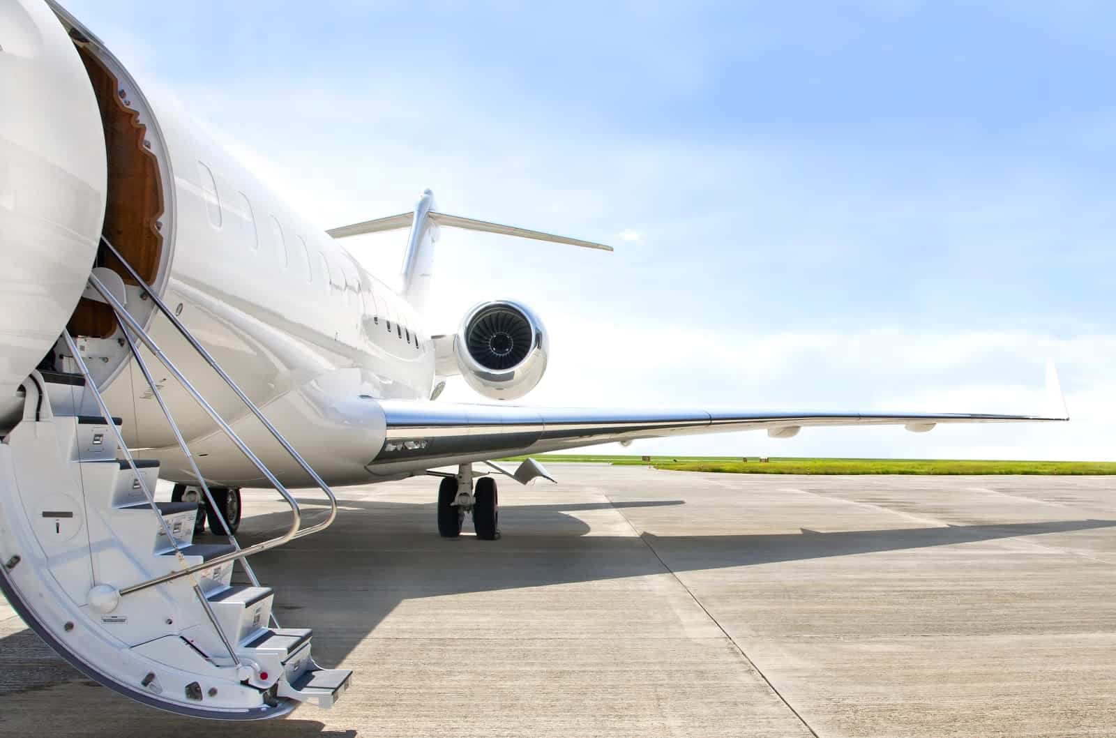 Private jet cost: a jet with its door open, ready to load passengers