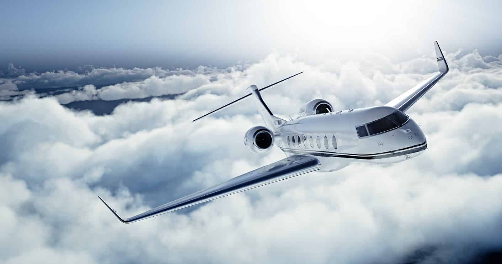 A private jet flying through the clouds