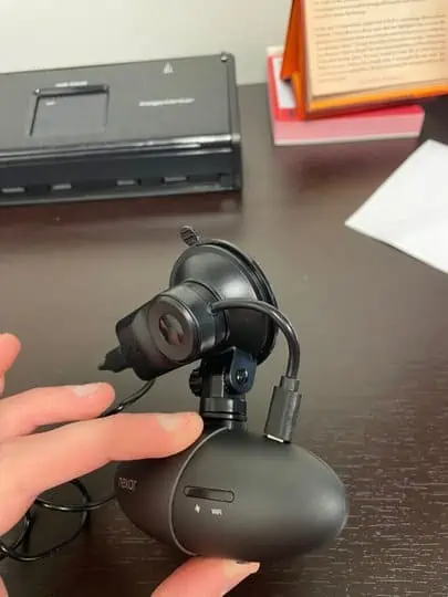picture of a hand holding a kingslim d4 dashcam - for kingslim d4 dash cam review