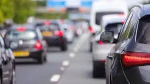 photo showing the cost of commuting - people stuck in bumper-to-bumper traffic
