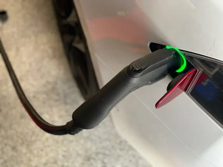 Lectron V-Box 48A EV Charging Station review - installation showing the charger cable plugged into a tesla charging outlet