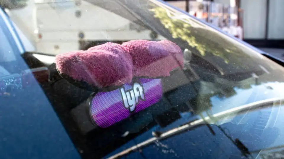 image of a lyft mustache in the windshield of a car