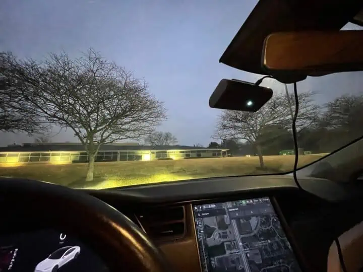 picture of a nexar one dash camera installed on the windshield of a car