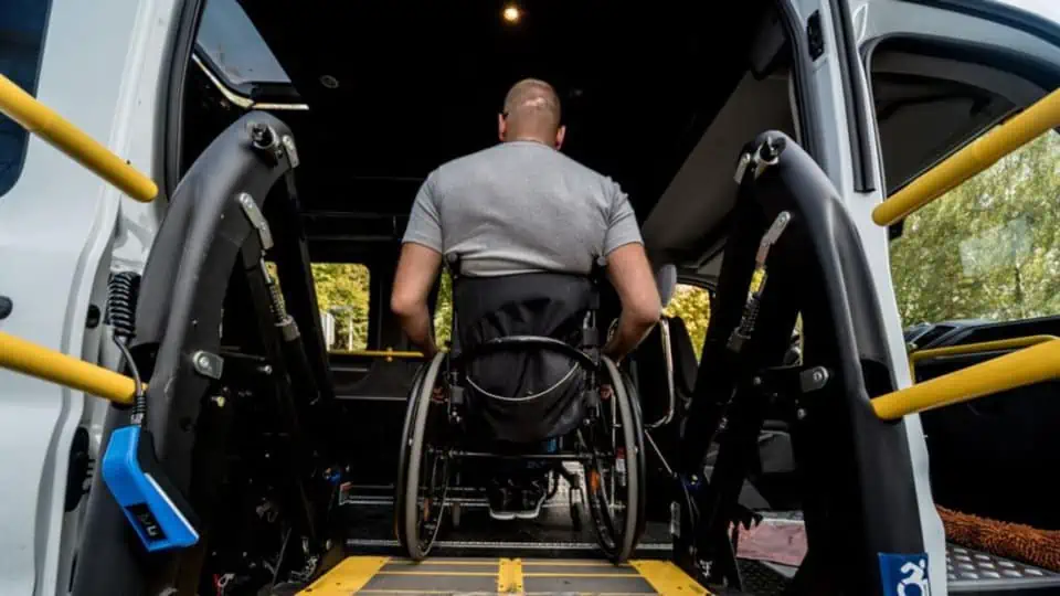 image showing a man in a wheelchair going into a vehicle like Uber Wav for drivers